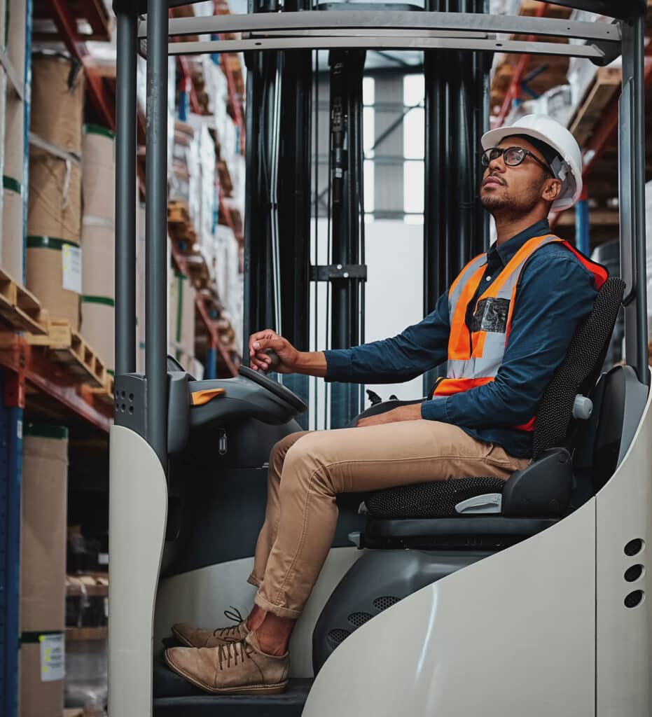 Forklift operator working in a warehouse